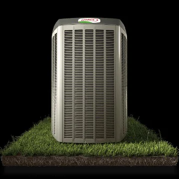 A gray Lennox HVAC outdoor unit with a louvered design sits on a patch of grass and dirt.