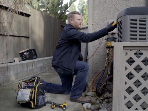 Environmental Heating & Air Solutions HVAC Technician Finishing AC Installation for HVAC Electrification in Roseville, CA