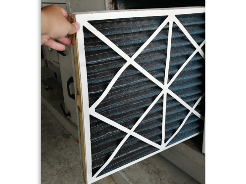 Technican changing air filter in Northern California