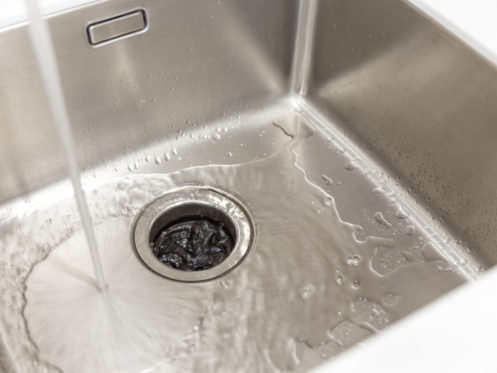 Draining water into the Garbage disposal in Northern, California